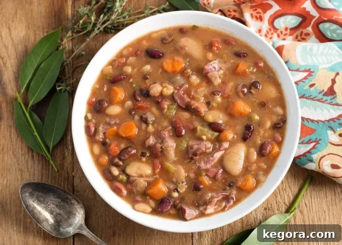 Hearty Instant Pot 15 Bean Soup 7 Instant Pot 15 Bean Soup in a white bowl on wood