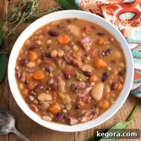Instant Pot 15 Bean Soup in white bowl on wood