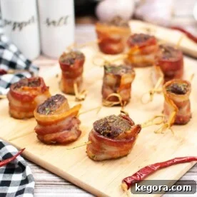 Air Fryer Bacon Wrapped Steak Bites on a board.