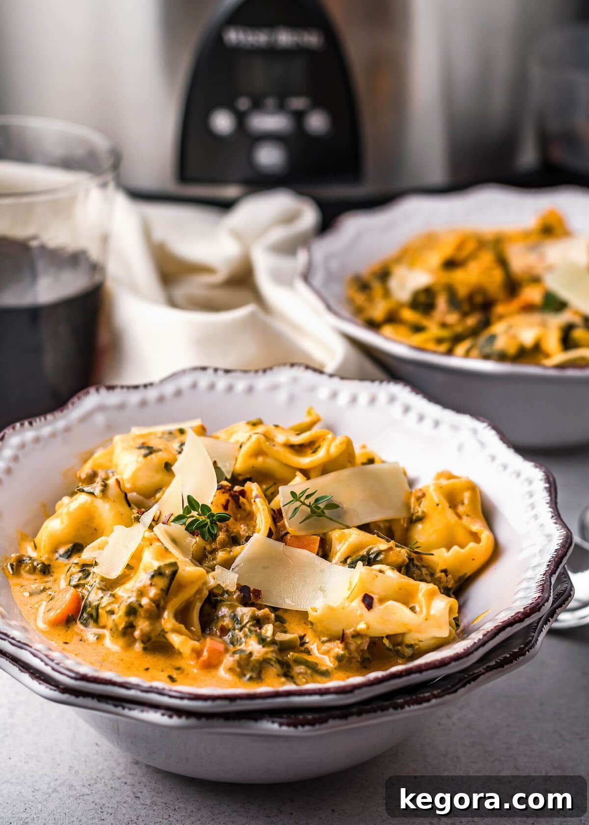 finished Creamy Tortellini Soup in a white bowl
