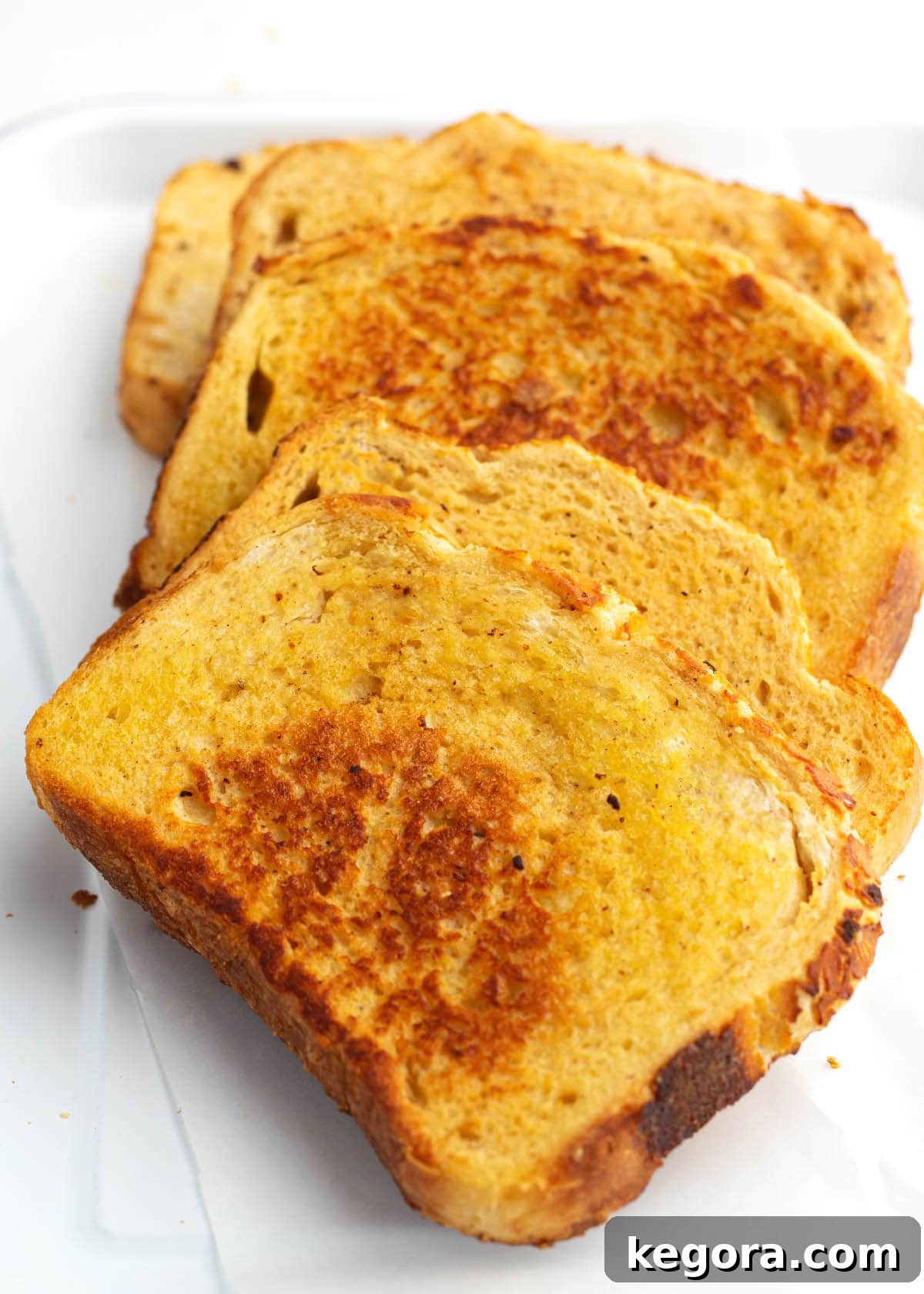 5 slices of cooked french toast on a plate
