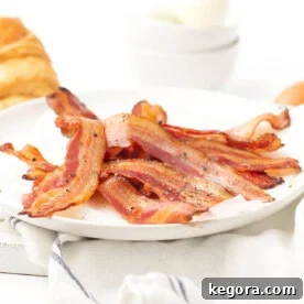 Perfectly Crisp Air Fryer Bacon 7 white plate of bacon