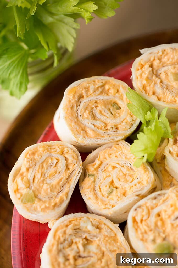 Spicy Buffalo Chicken Swirls 3 Several Buffalo Chicken Pinwheels on red plate