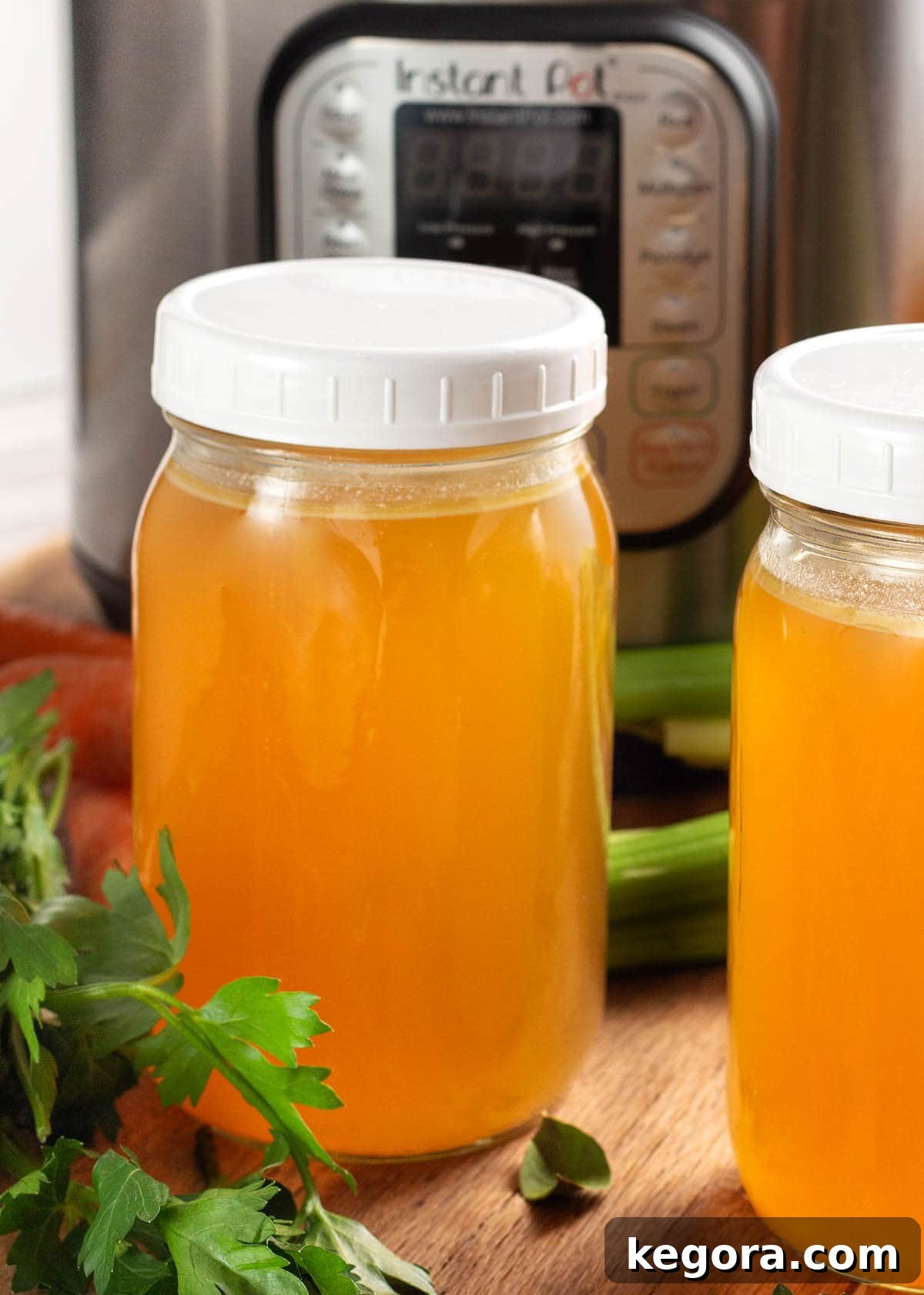 Instant Pot Turkey Broth in jars in front of an IP