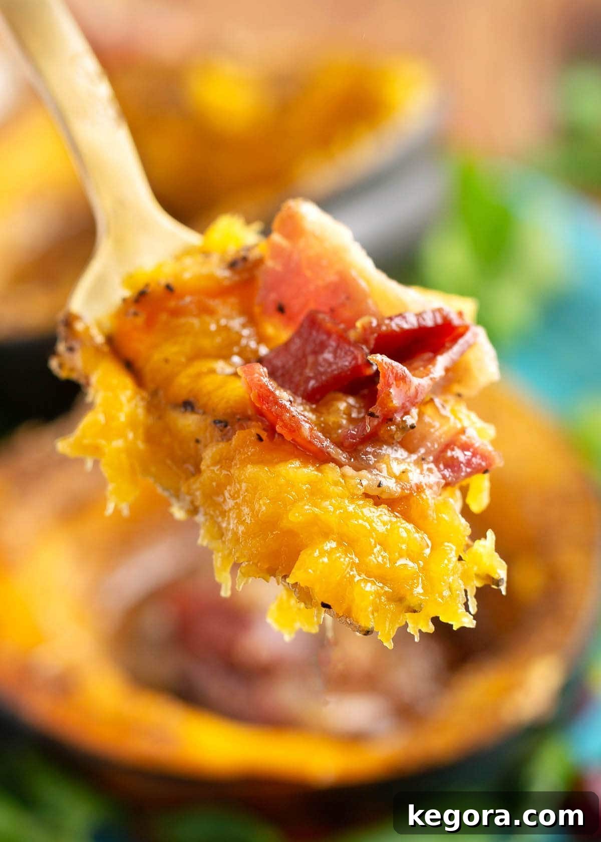 Effortless Slow Cooker Acorn Squash 3 A forkful of tender acorn squash with crispy bacon, highlighting the appealing texture and delicious optional addition.