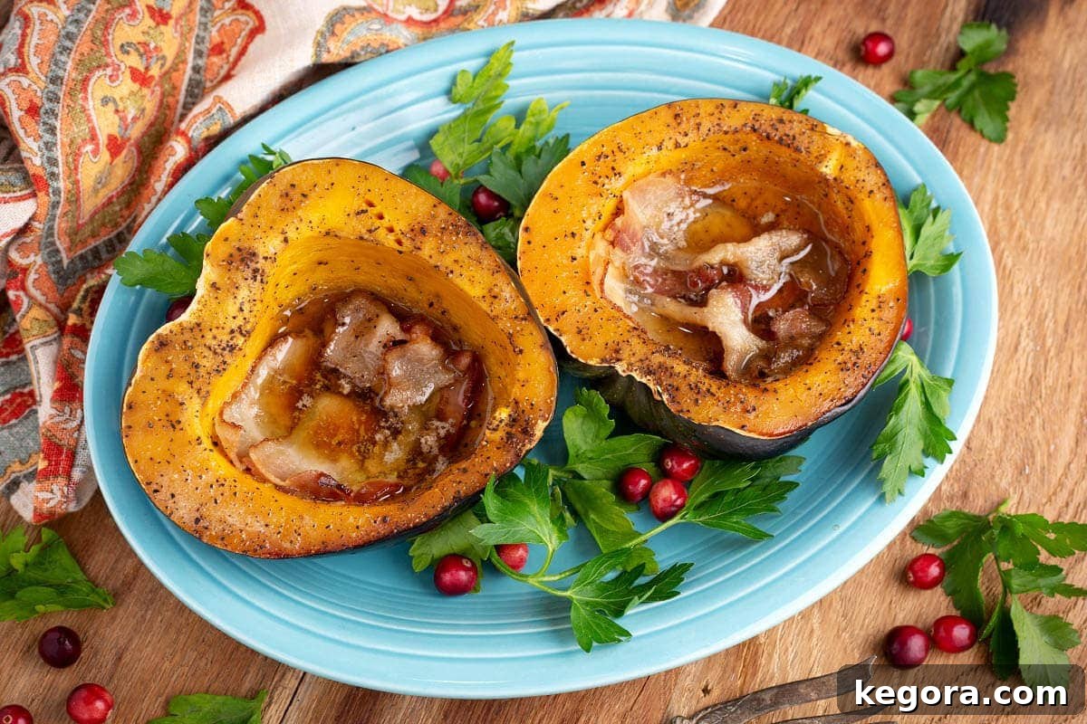 Effortless Slow Cooker Acorn Squash 6 A single acorn squash half beautifully presented on a blue plate, garnished and ready to be served as a delightful side dish.