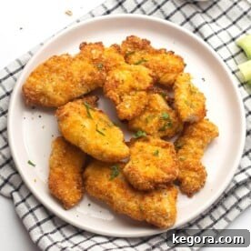 Crispy Air-Fried Nuggets 11 Air Fryer Chicken Nuggets on a white plate