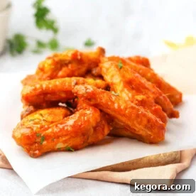 Crispy Air Fryer Buffalo Wings 13 Air Fryer Buffalo Chicken Wings on a board