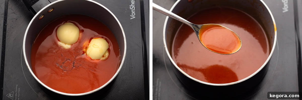 Crispy Air Fryer Buffalo Wings 7 Buffalo sauce simmering in a small pan, with a spoon lifted to show its rich texture.