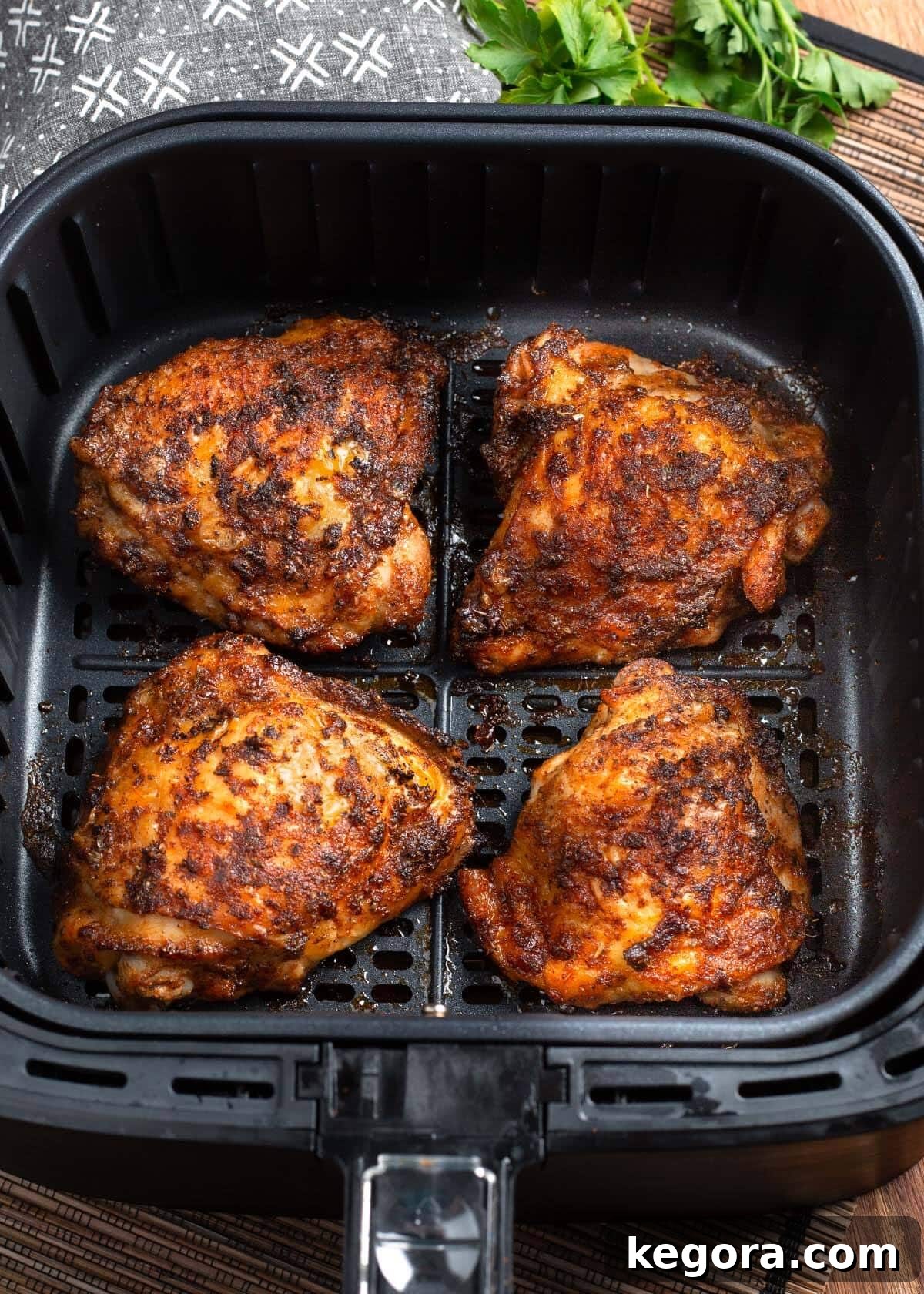 Air Fryer Chicken Thighs in air fryer basket