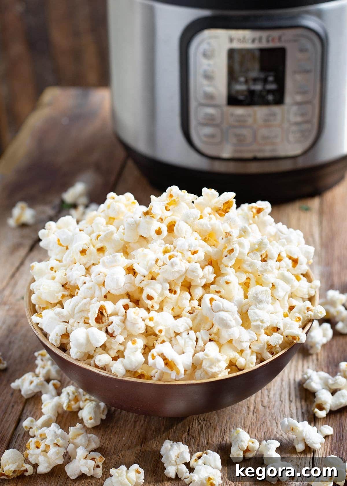 Popcorn Perfection in the Instant Pot 2 Instant Pot Popcorn in wood bowl in front of IP