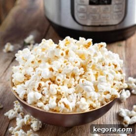 Popcorn Perfection in the Instant Pot 8 Instant Pot Popcorn in wood bowl in front of IP