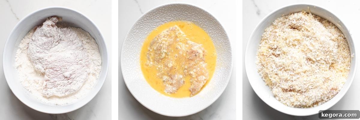 Ultimate Air Fryer Chicken Parmesan 5 Three shallow bowls containing flour, whisked eggs, and Panko breadcrumbs with parmesan.