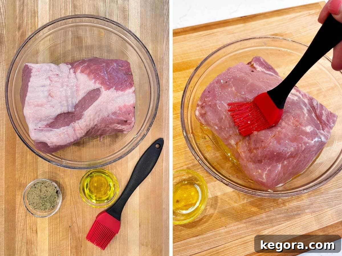 raw pork roast on cutting board, brushing oil on roast