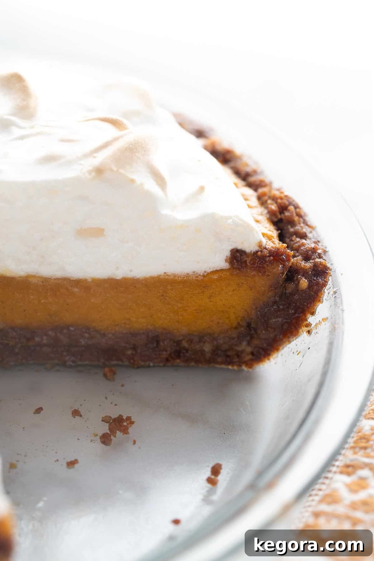 Full Gluten-Free Sweet Potato Pie A full gluten-free sweet potato pie in a glass pie plate, ready to be served, with a hint of the golden-brown meringue.