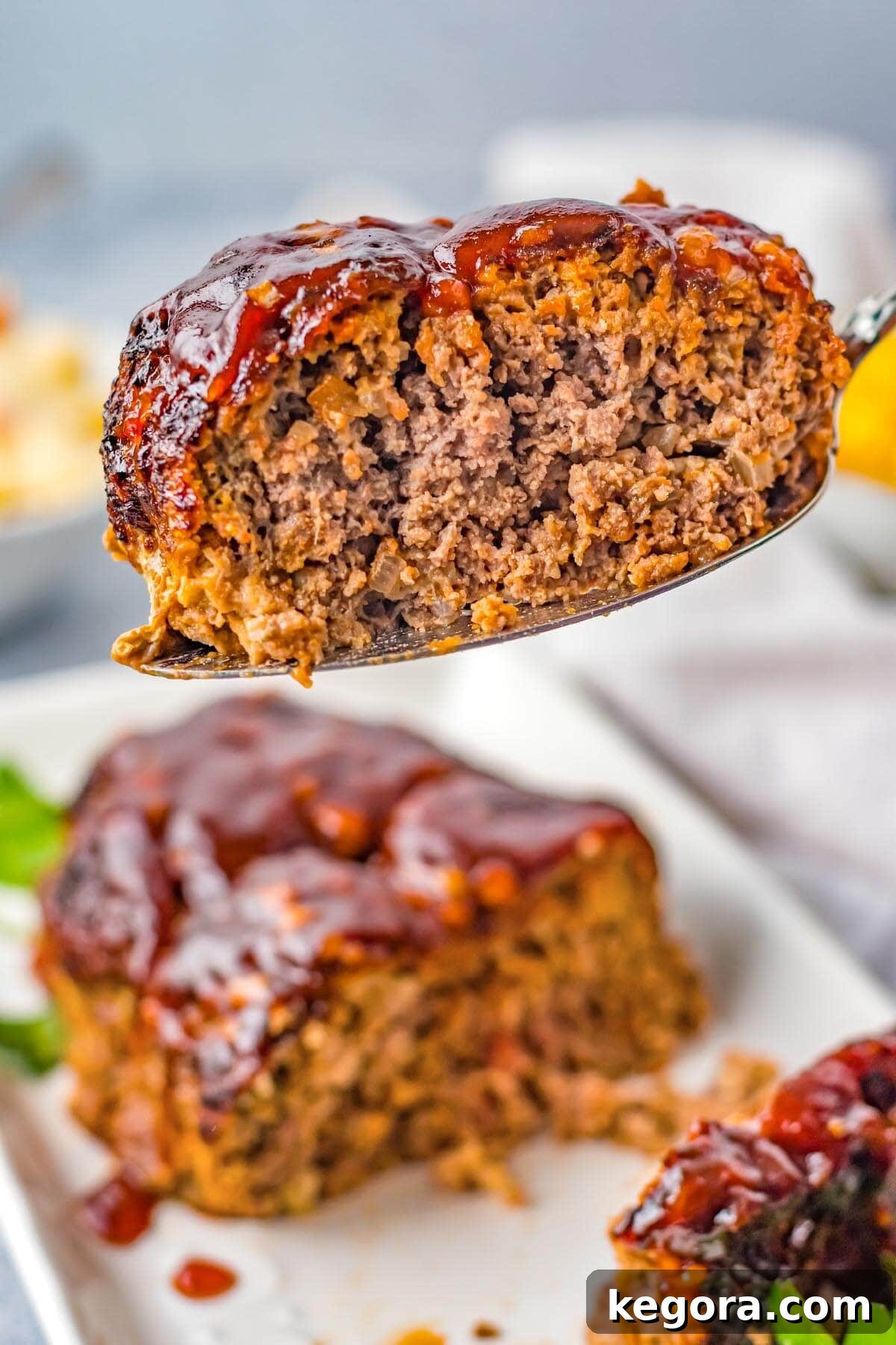 Crispy Air Fryer Meatloaf 2 Air Fryer Meatloaf slice on a spatula