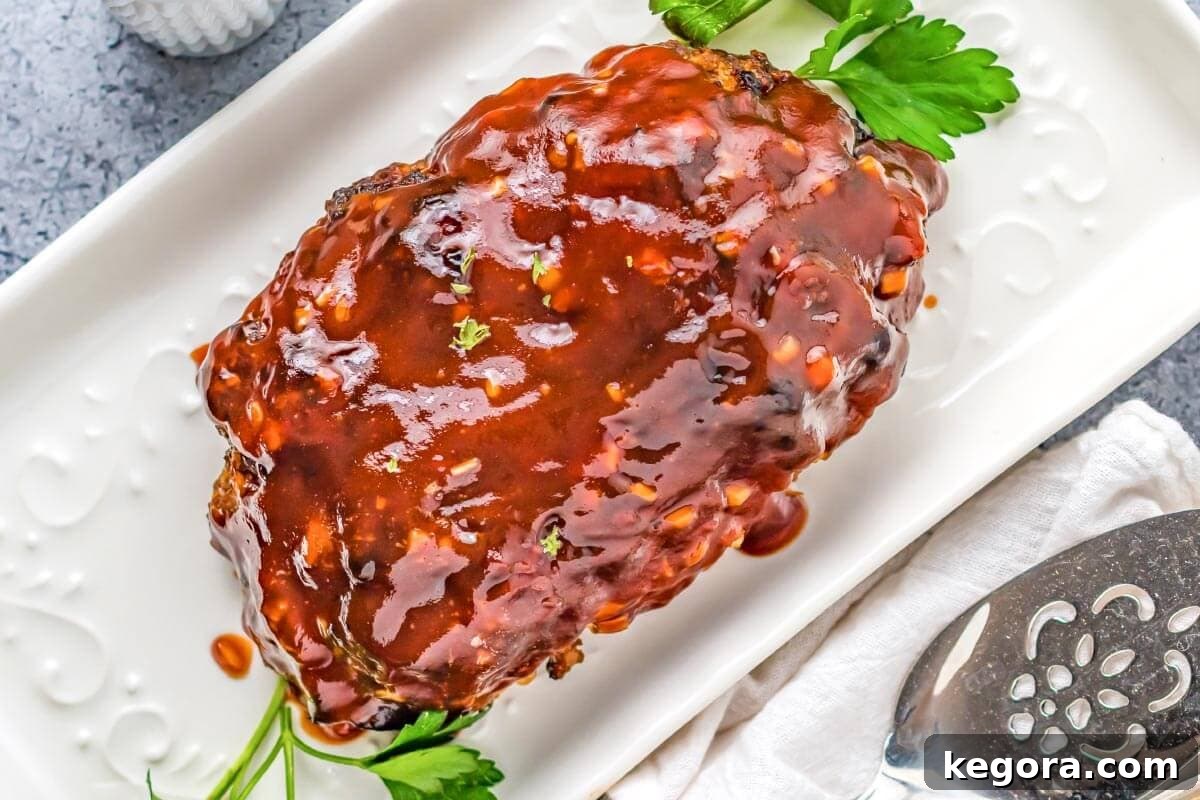 Crispy Air Fryer Meatloaf 3 Air Fryer Meatloaf on a white platter