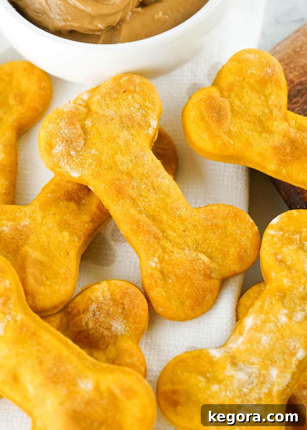 Easy Air Fryer Snacks for Pups 2 A pile of freshly made Air Fryer Dog Treats, shaped like bones