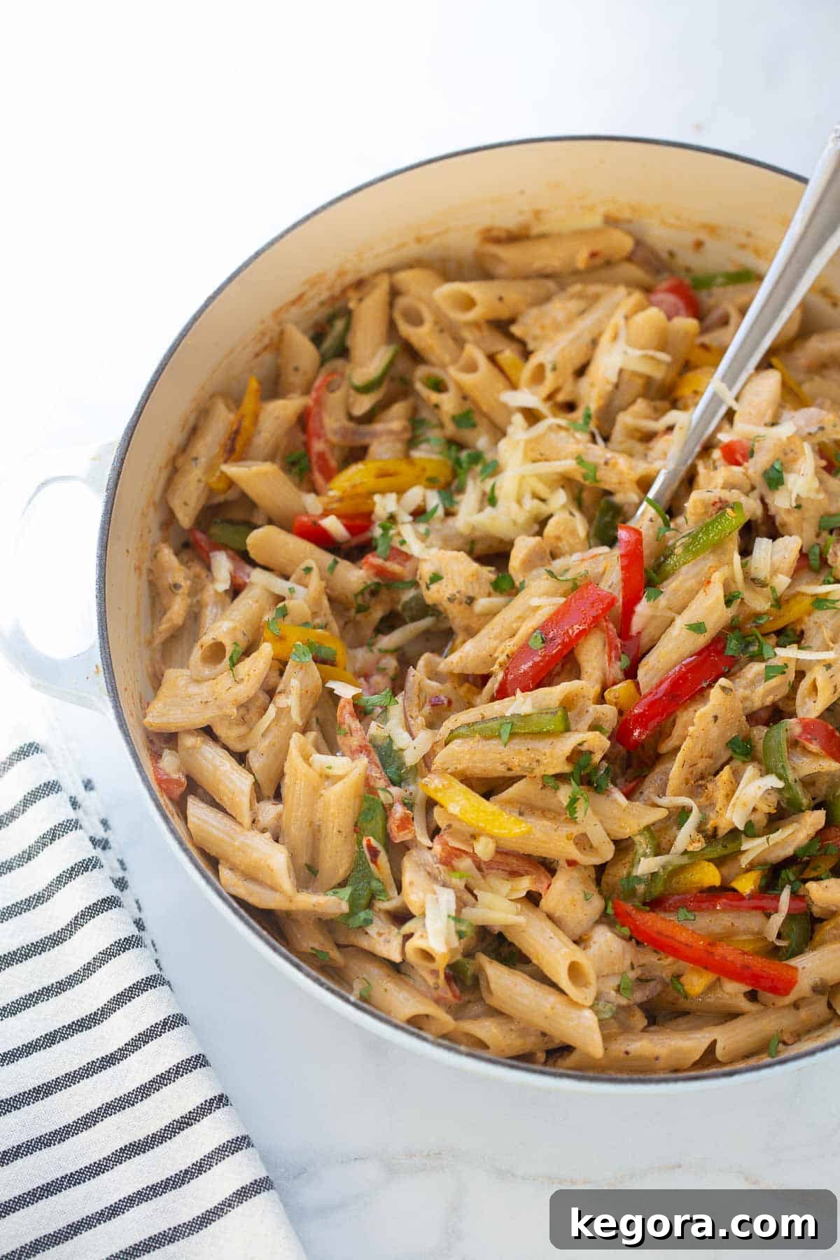 Gluten-Free Fajita Pasta A large skillet filled with gluten-free chicken fajita pasta, ready to serve.