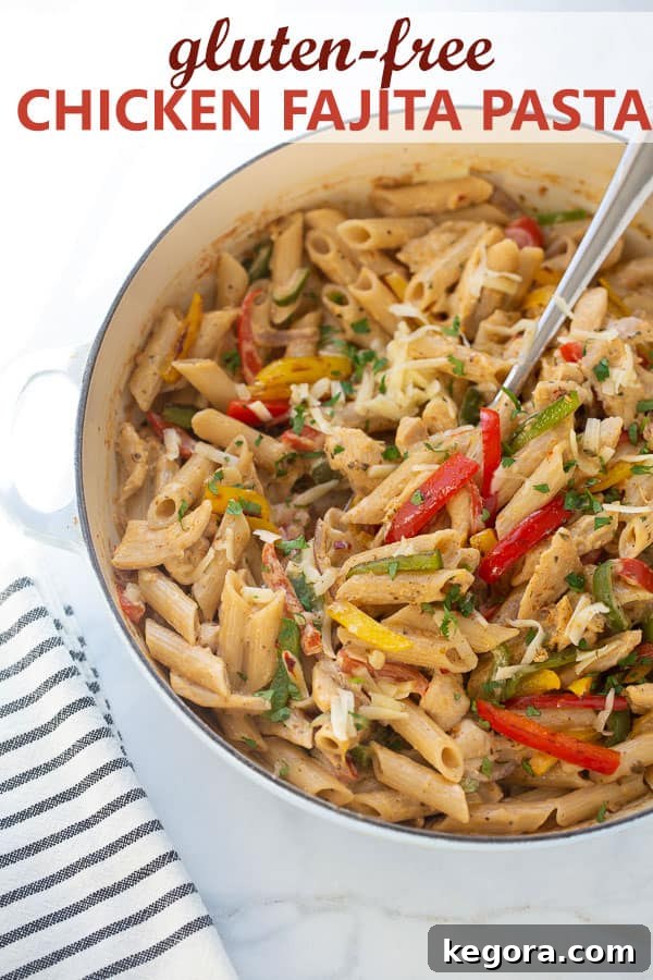 Fajita Pasta A vibrant shot of chicken fajita pasta served directly in a cooking skillet, ready for a family meal.