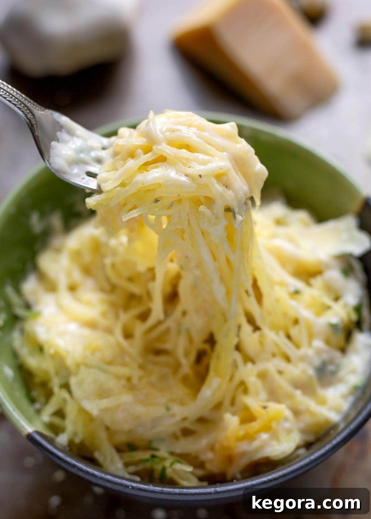 Velvety Garlic Parmesan Sauce 4 Garlic Parmesan Sauce on spaghetti squash on a fork.