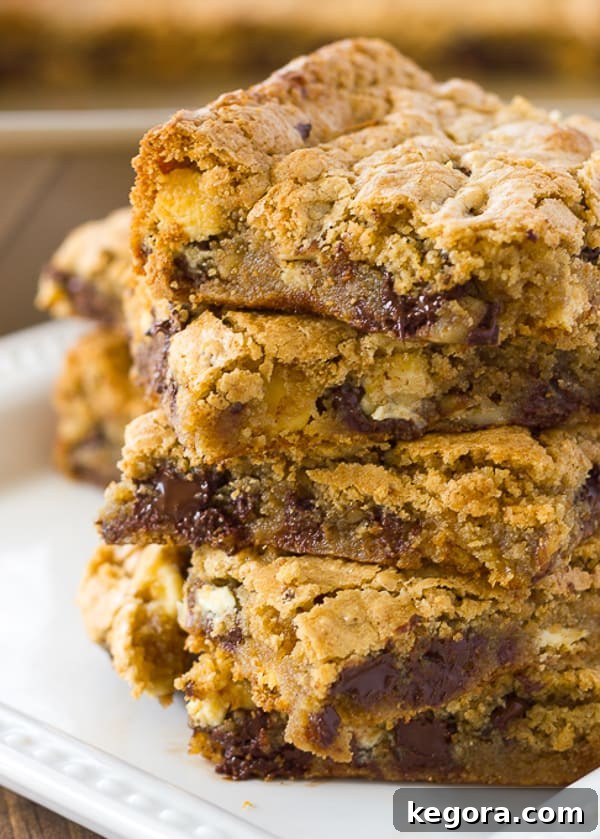 Delicious Almond Flour Blondies Gluten Free and Dairy Free 3 Close-up of a square of gluten-free blondie, showcasing its chewy texture, melted chocolate chips, and chopped pecans.