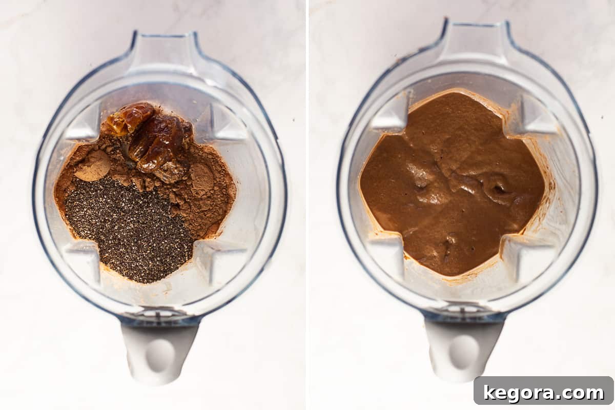 Ingredients for chocolate chia seed pudding recipe being blended in a high-speed blender, showing raw cacao, almond milk, and dates for a smooth consistency