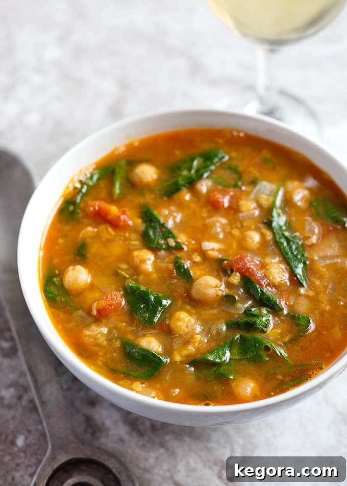 Hearty Instant Pot Moroccan Chickpea Stew served in a pristine white bowl, showcasing its vibrant colors and rich texture.