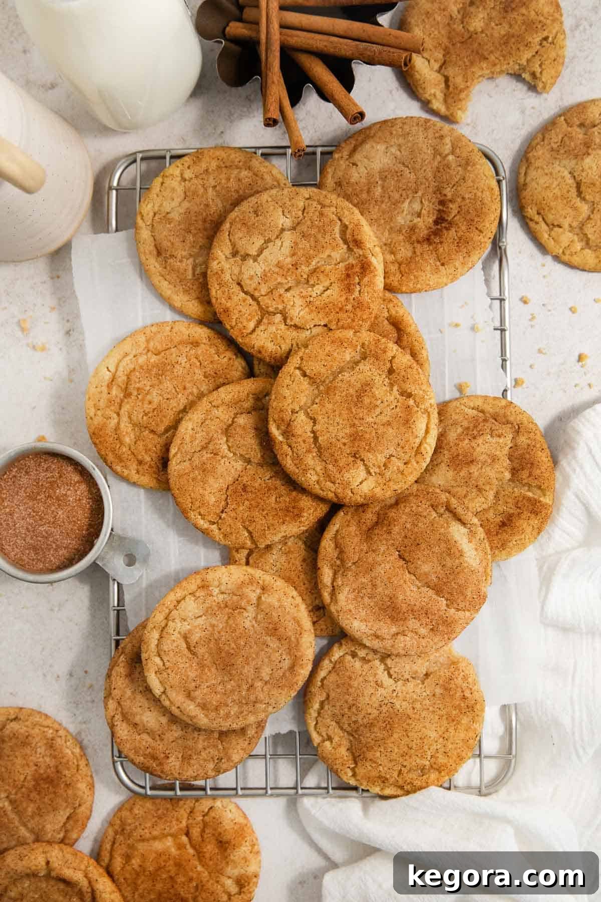 Golden brown gluten-free snickerdoodles cooling on a wire rack, ready to be enjoyed.