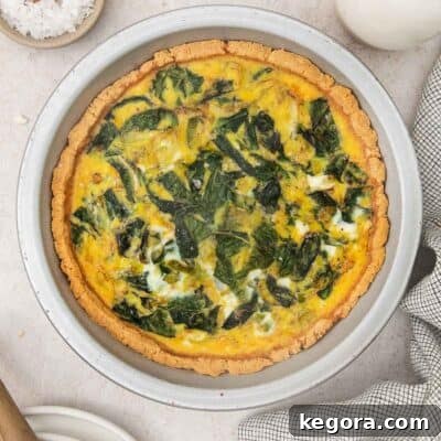 Nutty and Savory Almond Quiche 9 Almond flour crust quiche with leeks and chard from above, showcasing a beautiful golden crust and vibrant filling.
