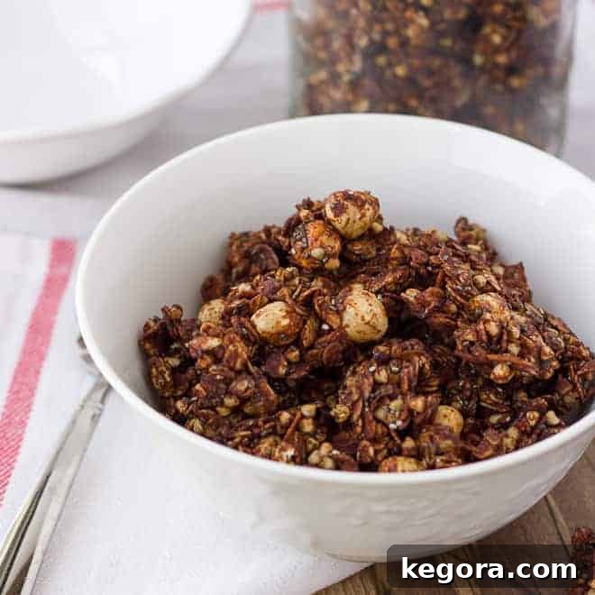 Decadent Chocolate Hazelnut Granola Gluten and Dairy Free 4 Close-up shot of chocolate granola in a white bowl, showcasing its texture