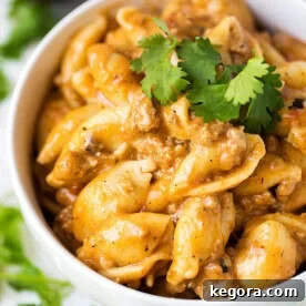 Instant Pot Cheesy Taco Pasta in a white bowl