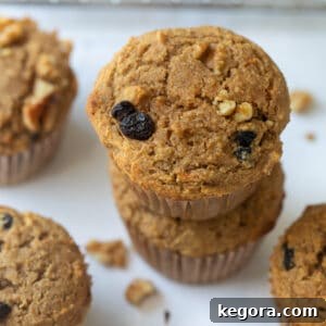buckwheat muffins stacked with wire rack in the background on white marble