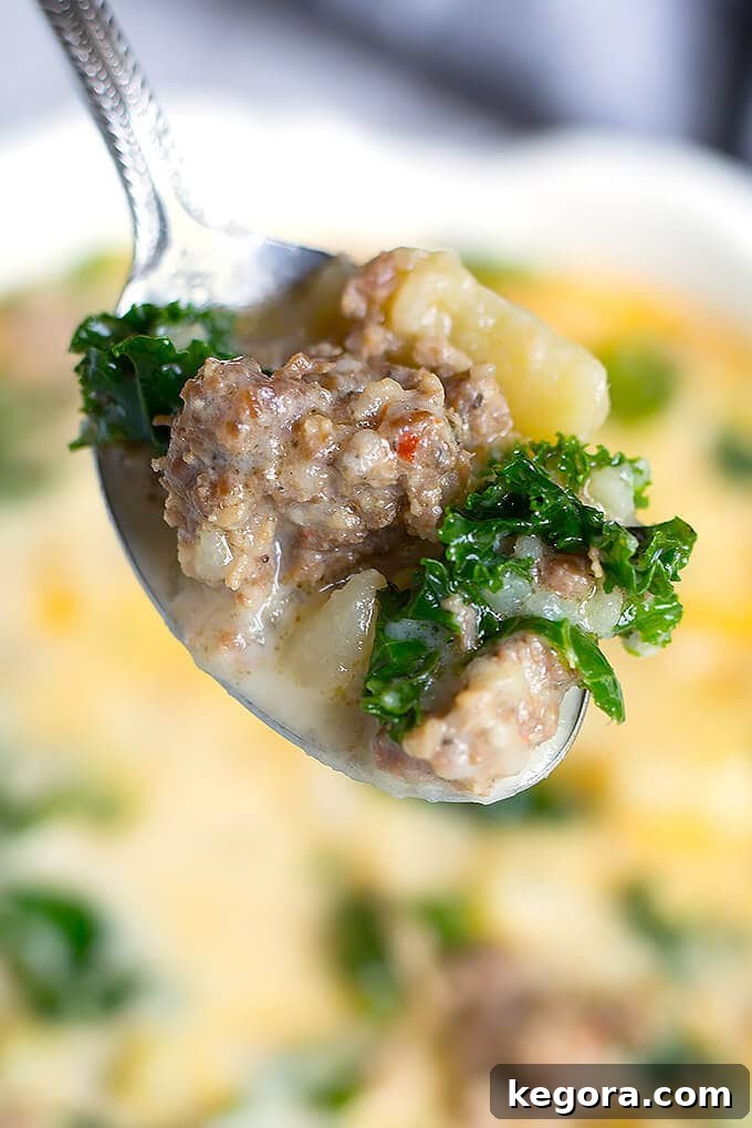 Instant Pot Creamy Tuscan Sausage and Potato Soup 3 Close up of spoonful of Zuppa Toscana