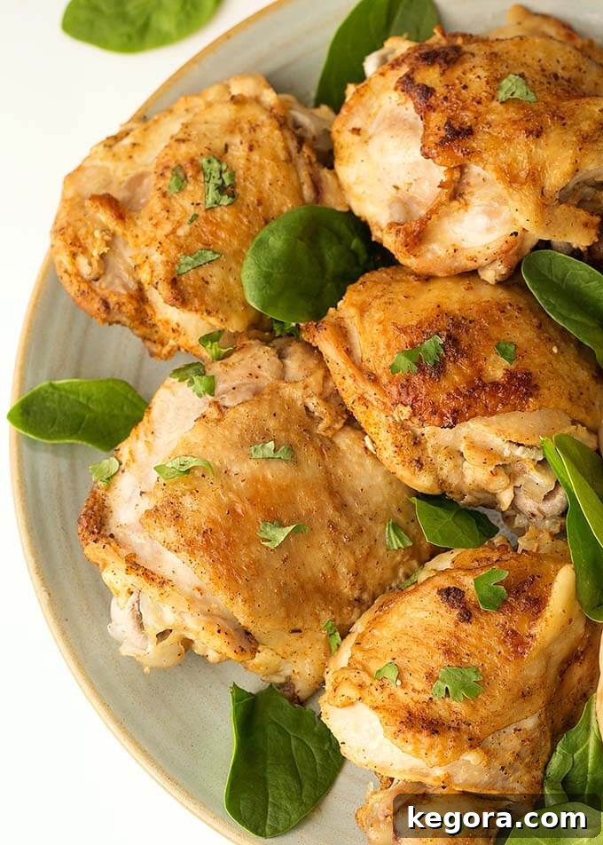 Close up of Instant Pot Chicken Thighs and potatoes on a white plate