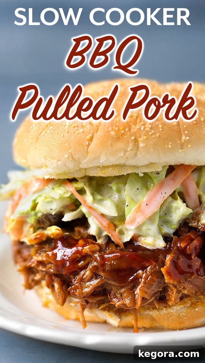 Very tasty Slow Cooker BBQ Pulled Pork will feed the whole family. This crock pot bbq pulled pork is easy to make on a busy day. Just set it and go! simplyhappyfoodie.com #pulledpork #bbqpulledpork #barbecuepulledpork #slowcookerpulledpork #crockpotpulledpork