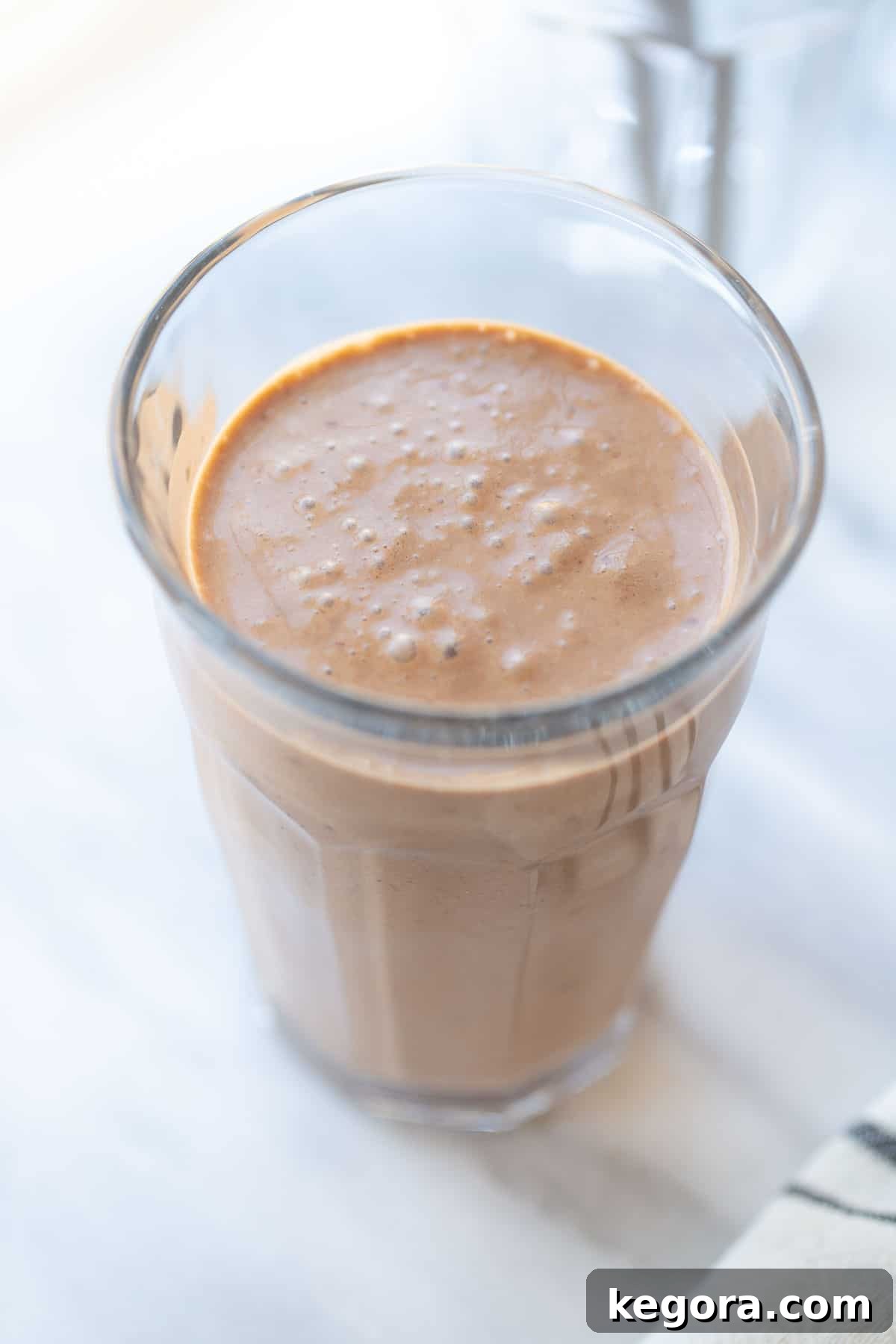 Chocolate Avocado Smoothie Recipe A glass of chocolate avocado and banana smoothie, ready to drink.
