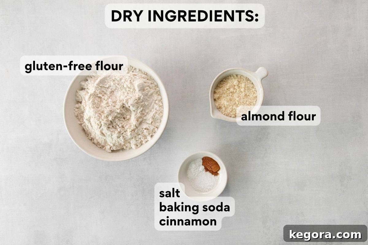 Dry ingredients pre-measured and labeled for gluten-free oatmeal raisin cookies.