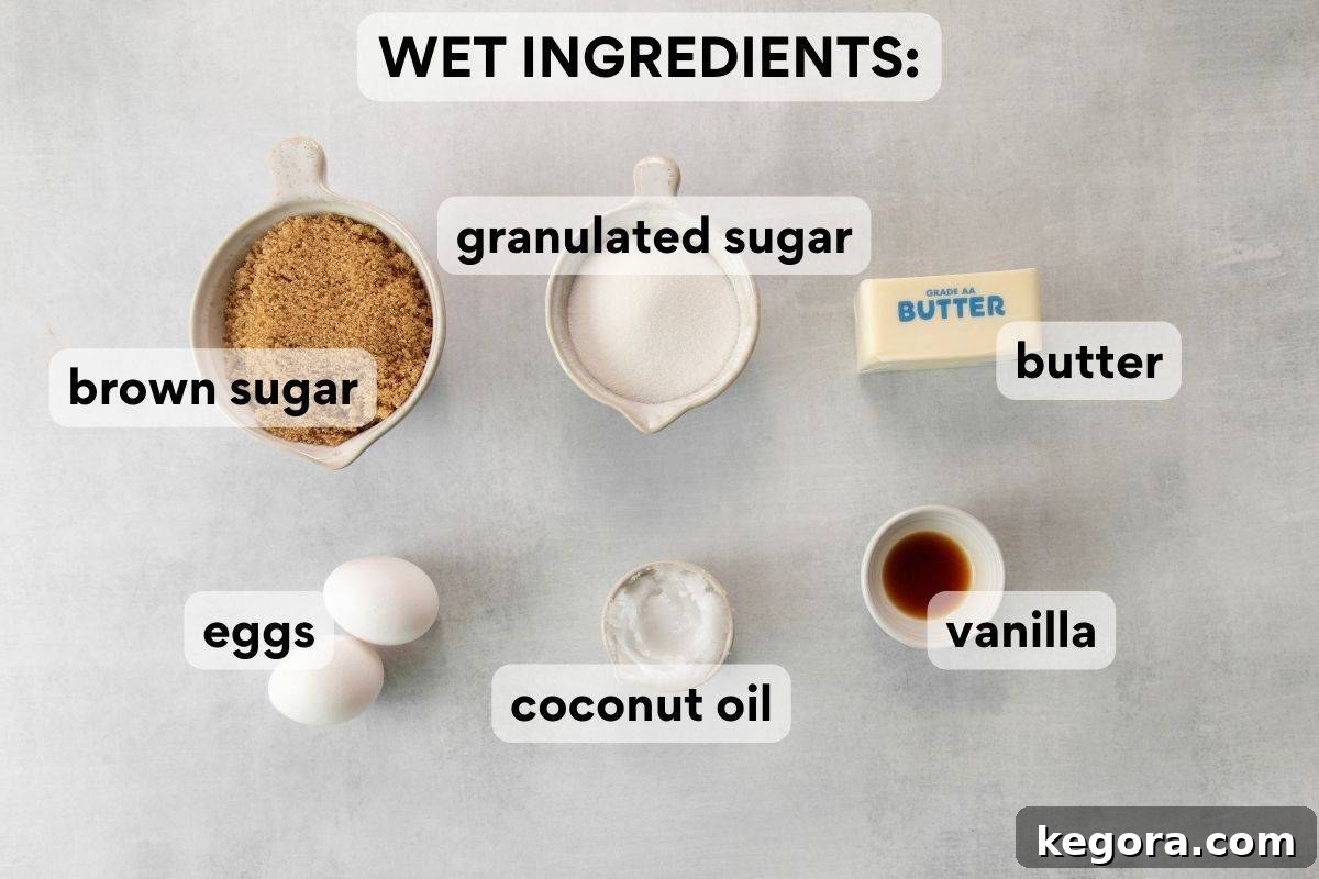 Wet ingredients pre-measured and labeled for baking gluten-free oatmeal raisin cookies.