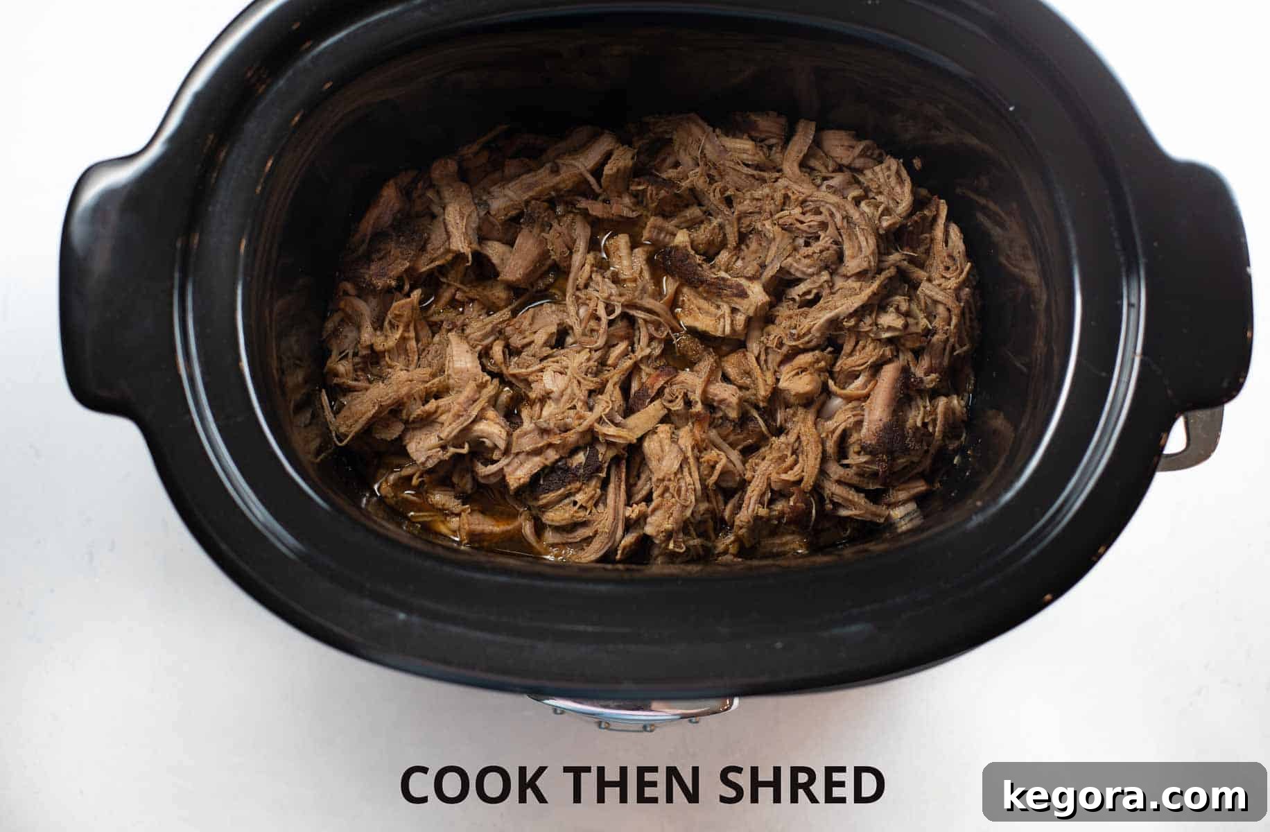 Fork-Tender Sweet Pork Tacos 6 shredded pork tenderloin in slow cooker after cooking