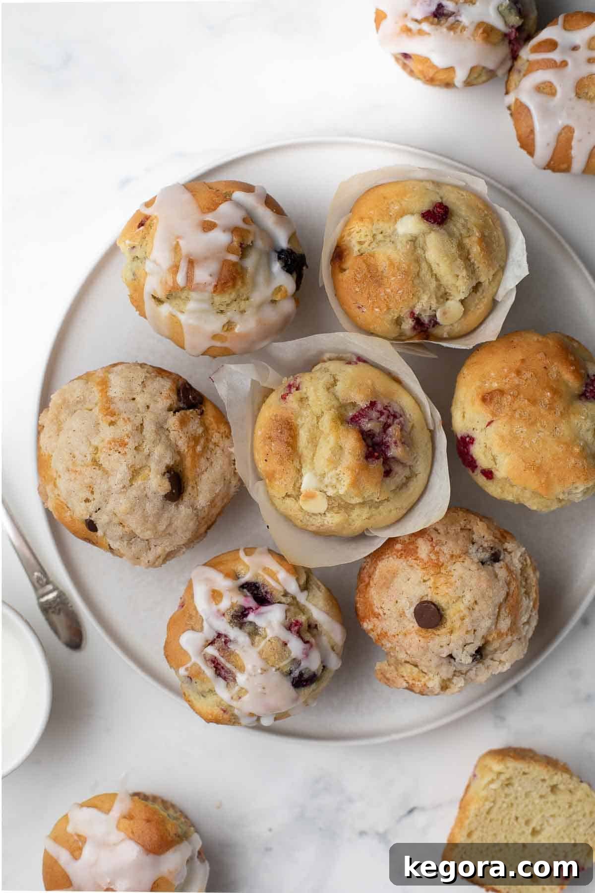 Overhead shot of freshly baked gluten-free muffins on a white plate, ready to be served.