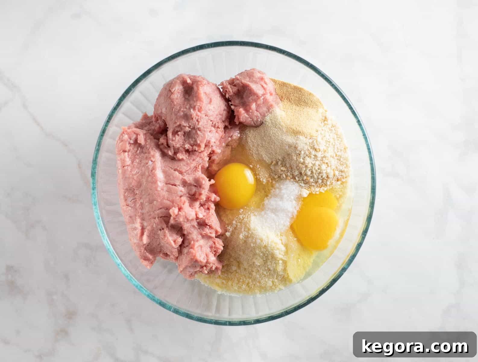 all meatball ingredients in a bowl ready for mixing