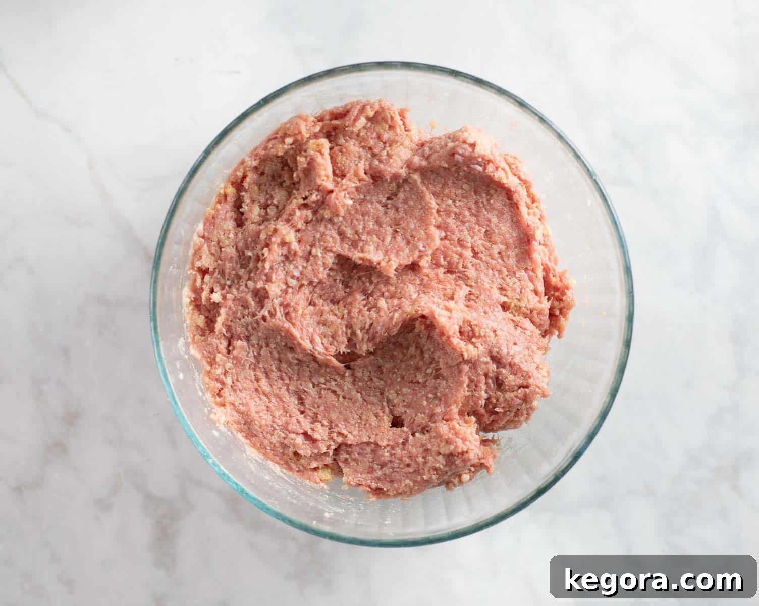 gluten-free meatball ingredients mixed together in a bowl