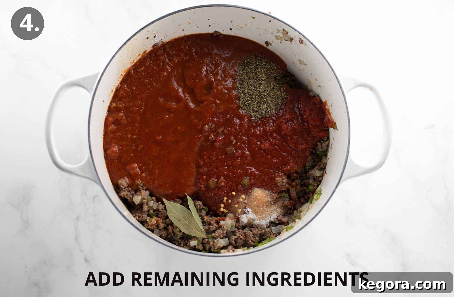 Perfect Gluten-Free Pasta Sauce 8 adding the rest of the ingredients to the pan with cooked meat.
