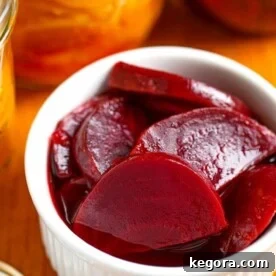 Pickled beets in small white bowl