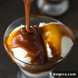 Perfect Homemade Caramel Sauce 3 Caramel sauce poured on to vanilla ice cream in small glass serving bowl