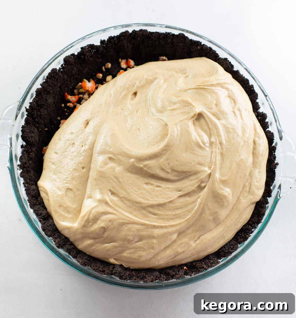 Oreo crust perfectly topped with the creamy, fluffy peanut butter pie filling, ready for chilling.