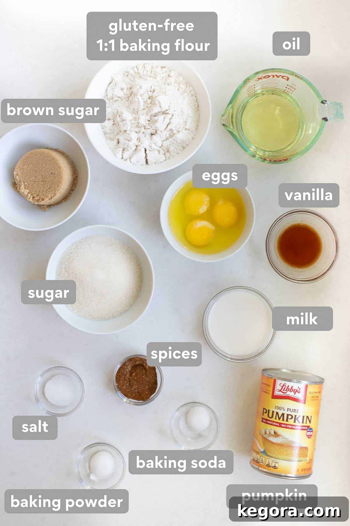 Guilt-Free Autumn Pumpkin Bars 3 Overhead shot of all the essential ingredients laid out on a countertop, including gluten-free flour, canned pumpkin, spices, eggs, and sugars.