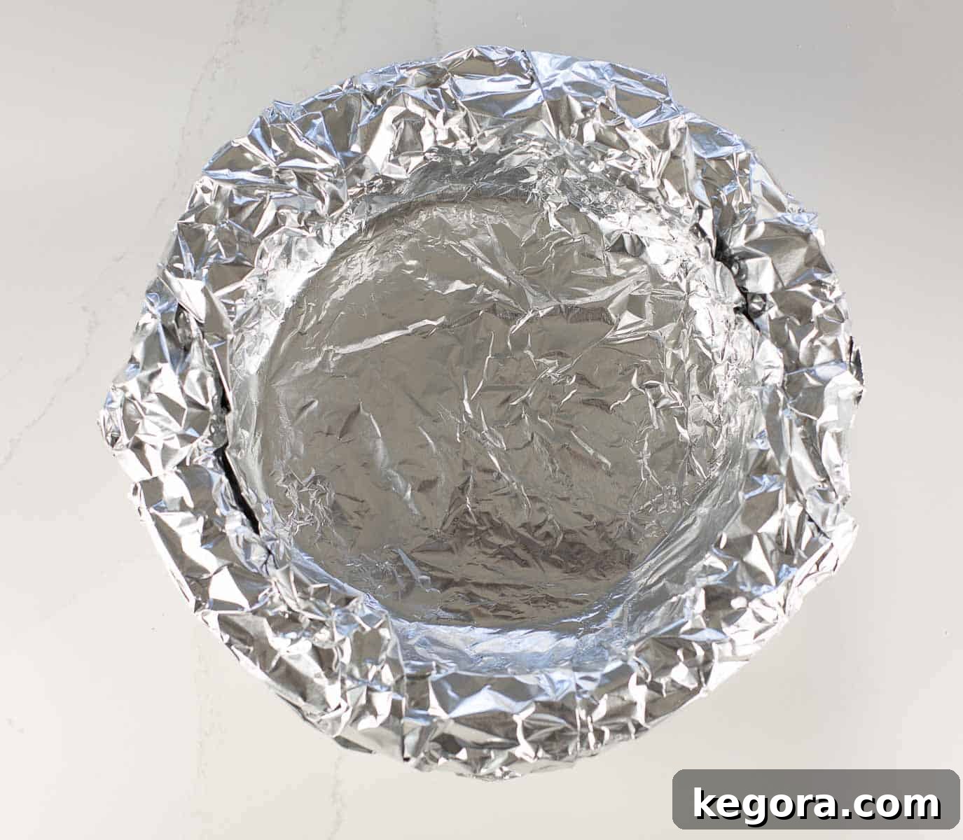 Decadent Gluten-Free Pecan Pie 6 pie crust covered in foil before par-baking