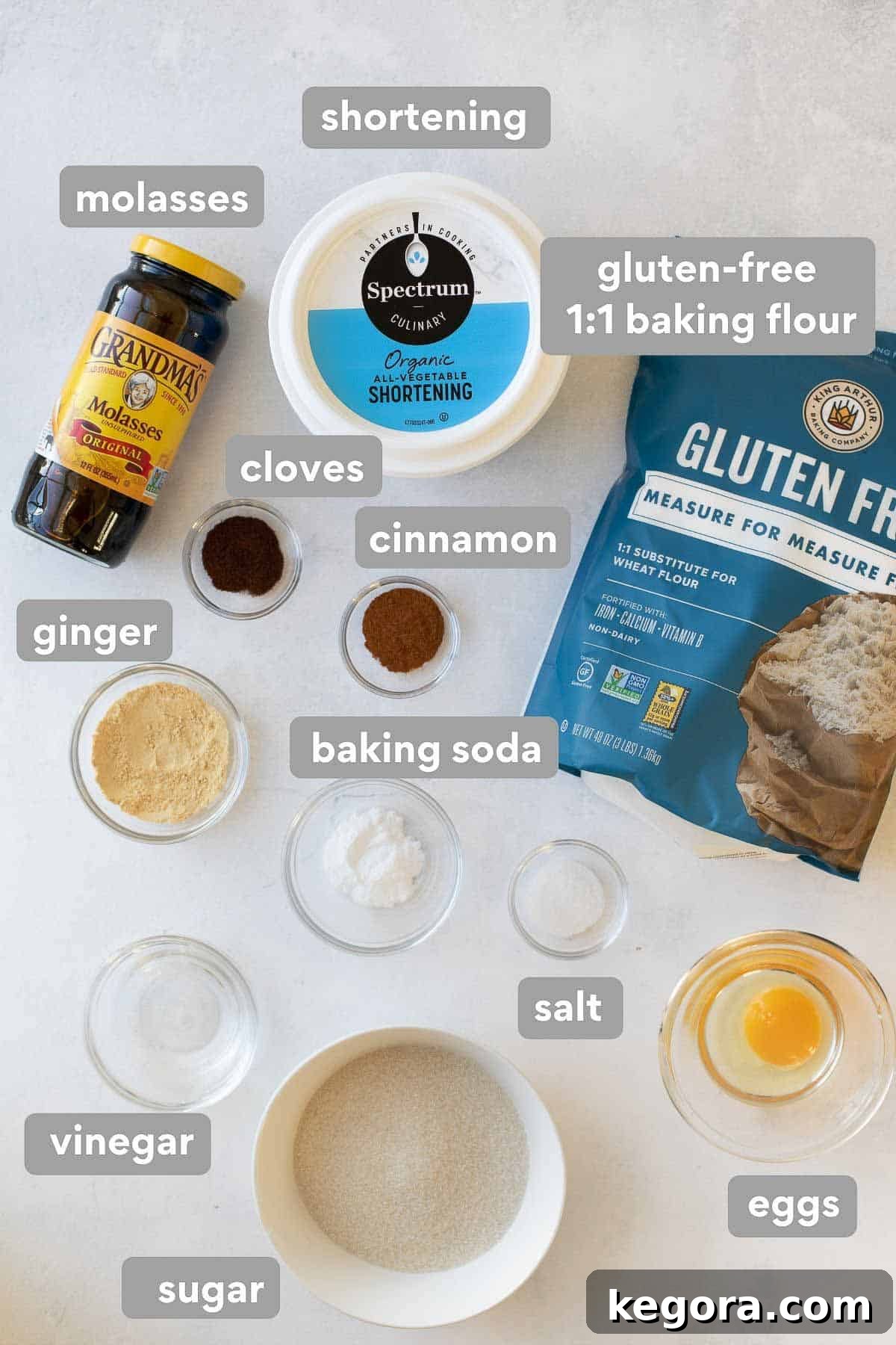 Spiced Gluten Free Gingerbread Delights 4 A collection of ingredients laid out for baking gluten-free gingerbread cookies, including flour, spices, molasses, and shortening.